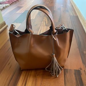 Small tan leather satchel with crossbody strap
